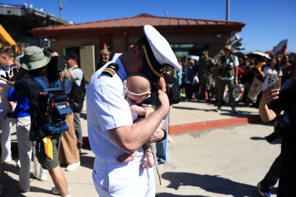 Daddy’s home!: 122 sailors aboard the Abraham Lincoln meet their children for the first time Daddy’s home!: 122 sailors aboard the Abraham Lincoln meet their children for the first time